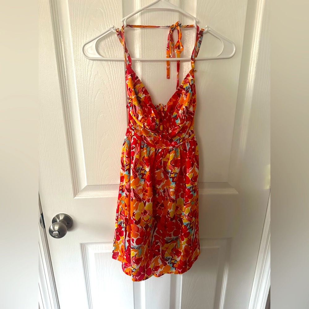 Flowery spring dress, it’s orange, yellow, pink, etc.